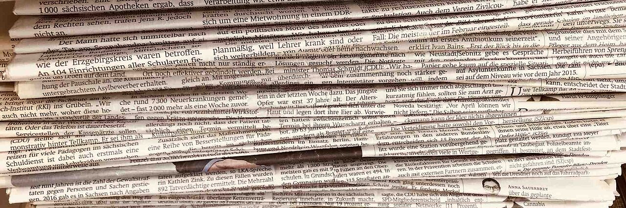 pile of newspapaers