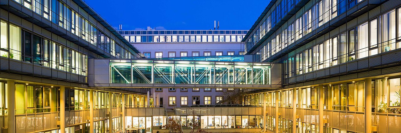 The illuminated inner courtyard of the Leibniz Institute for Solid State and Materials Research – IFW Dresden.
