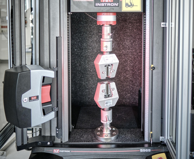  Instron 5969 testing machine with clamped specimen.