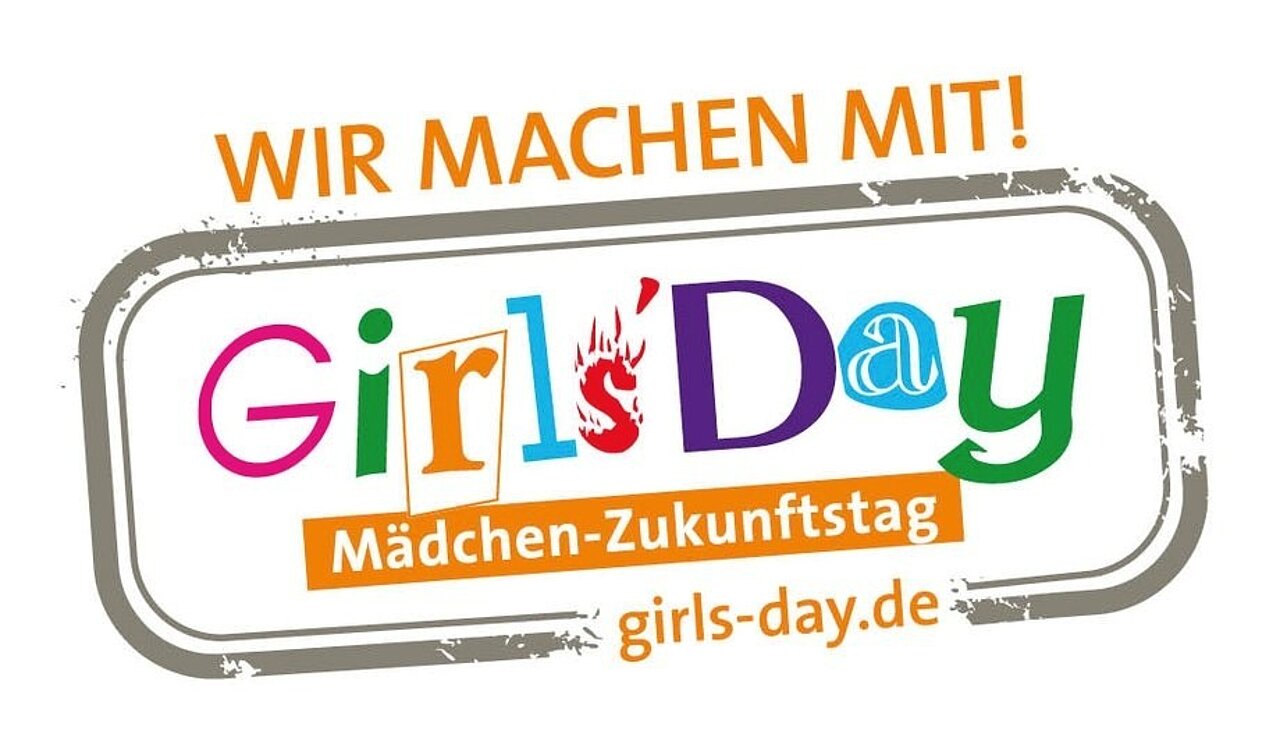 Das Girls'Day Logo mit bunten Buchstaben und der Aufschrift „Wir machen mit“ auf weißem Hintegrund.