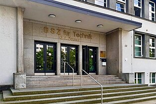 BSZ für Technik "Gustav-Anton-Zeuner" Dresden Entrance area of the Vocational School for Technology with wide stairs, handrails, and the inscription 'BSZ für Technik' above the door, surrounded by windows and a light facade.