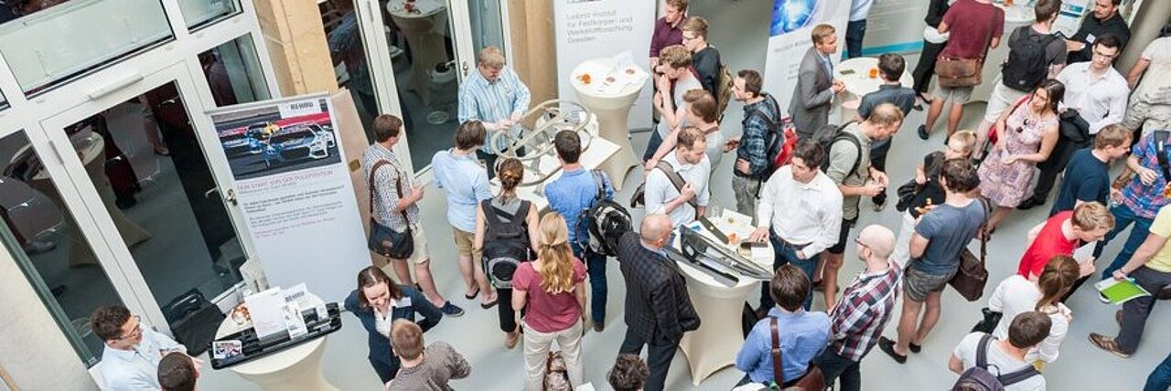 event photo with many people in the atrium of IFW