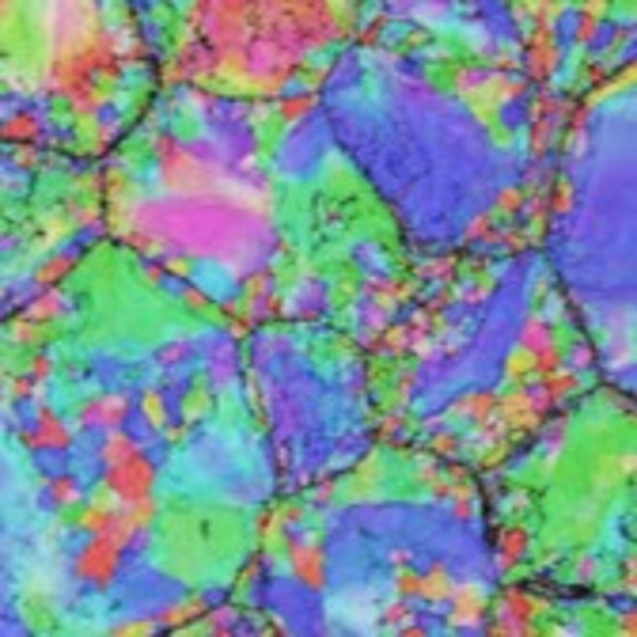 Microscopy image of a Ti-Nb microstructure consisting of grains of varying sizes and orientations, shown in different colors.
