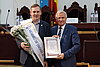 Prof. Dr. Kornelius Nielsch (left) and Prof. Ion Tiginyanu stand side by side, holding the certificate of Honorary Membership of the Academy of Sciences of Moldova for the camera.