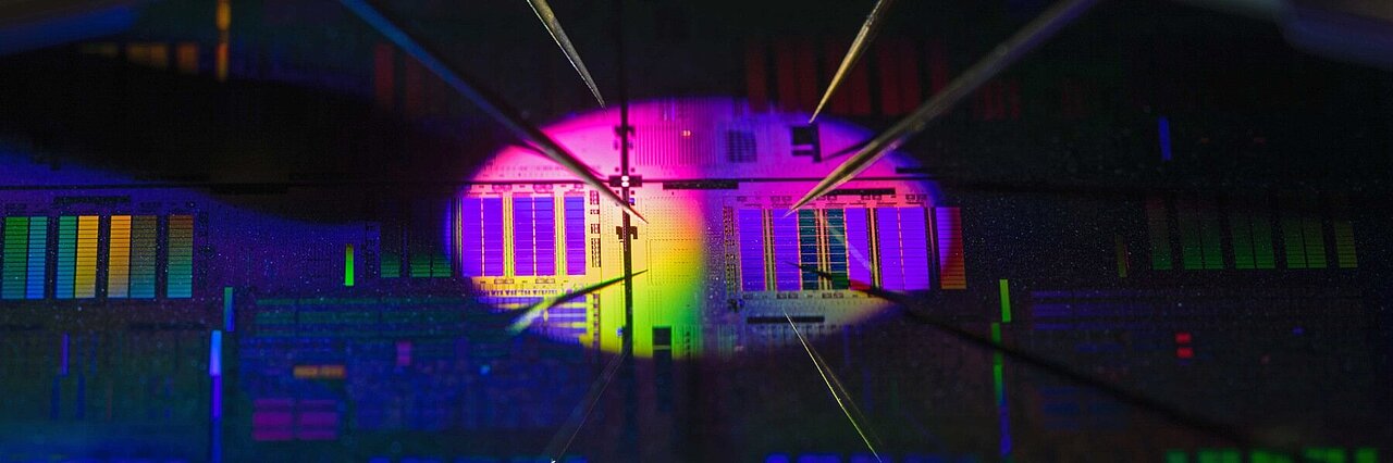 Surface of a chip, violet illuminated in dark surroundling
