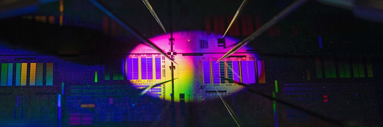 Surface of a chip, violet illuminated in dark surroundling