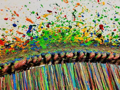 Close-up of a spin bike showing wear marks on the inside of bucket after several creations of art. 