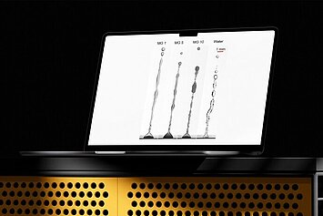 Laptop displaying different liquid jets from microgel solutions and water.